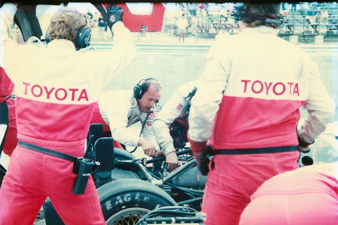 David Wilson, tending to the engine of one of Dan Gurney's All American Racer cars in the pit.