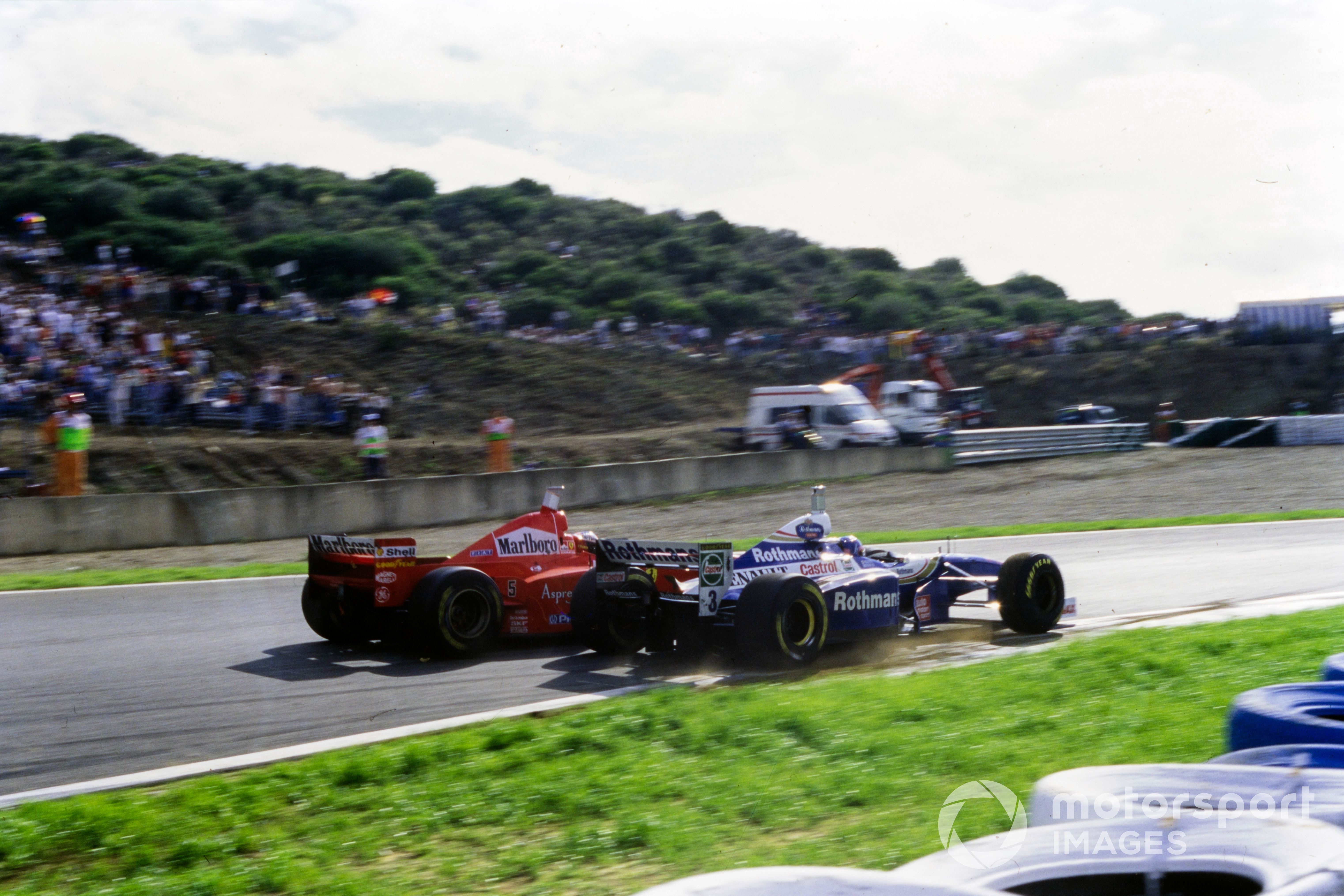 The controversial collision between Michael Schumacher, Ferrari F310B, and Jacques Villeneuve, Williams FW19 Renault. Schumacher was judged to have deliberately turned in on his rival Villeneuve, and subsequently was excluded from the entire championship as a result.