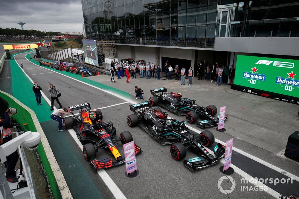 Pole man Sir Lewis Hamilton, Mercedes W12, Valtteri Bottas, Mercedes W12, and Max Verstappen, Red Bull Racing RB16B, arrive in Parc Ferme after Qualifying