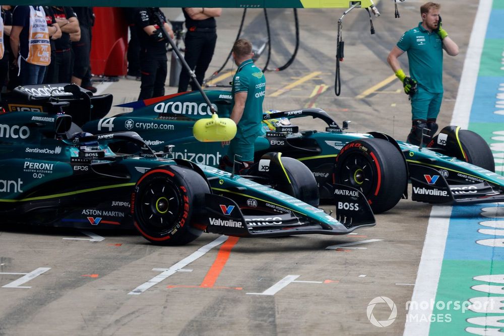 Lance Stroll, Aston Martin AMR23, Fernando Alonso, Aston Martin AMR23, outside the garage
