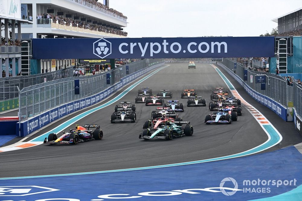Sergio Perez, Red Bull Racing RB19, leads the field at the start