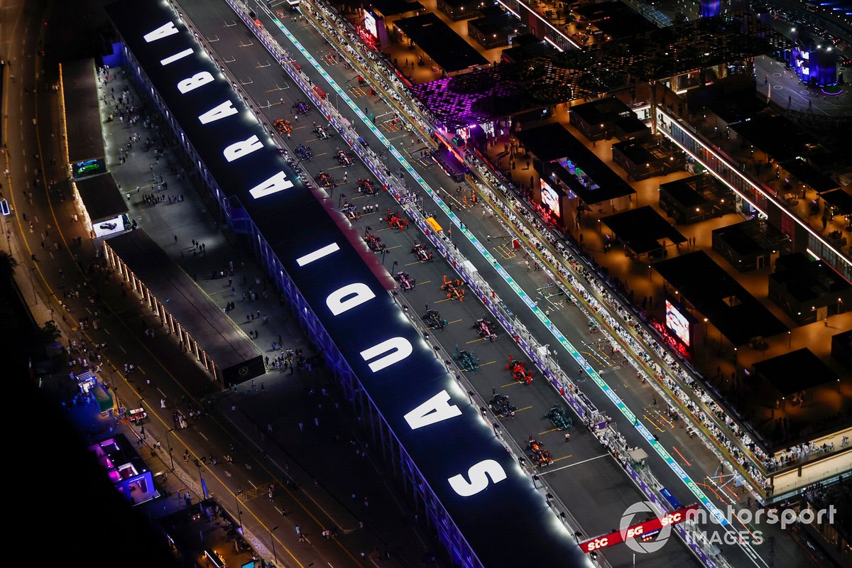 Mechanics make final preparations on the grid prior to the start