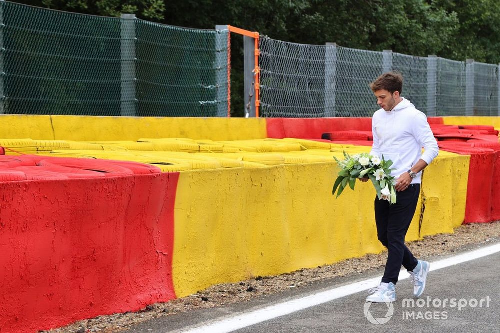 Pierre Gasly, AlphaTauri, lays flowers in memory of Anthoine Hubert