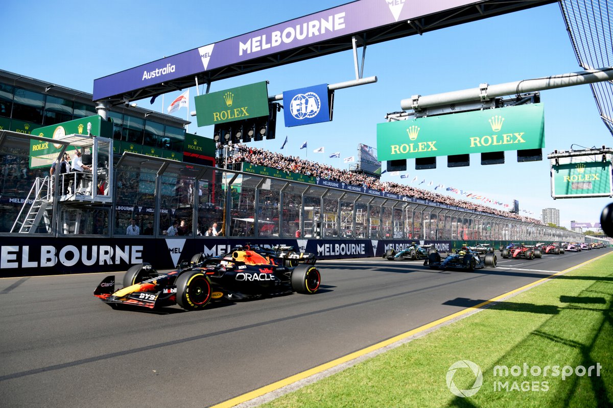 Max Verstappen, Red Bull Racing RB19, leads George Russell, Mercedes F1 W14, Sir Lewis Hamilton, Mercedes F1 W14, and the rest of the field at the start