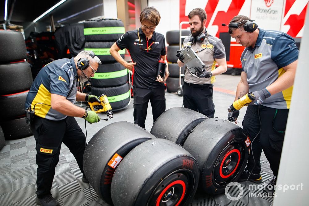 Pirelli technicians work on some tyres