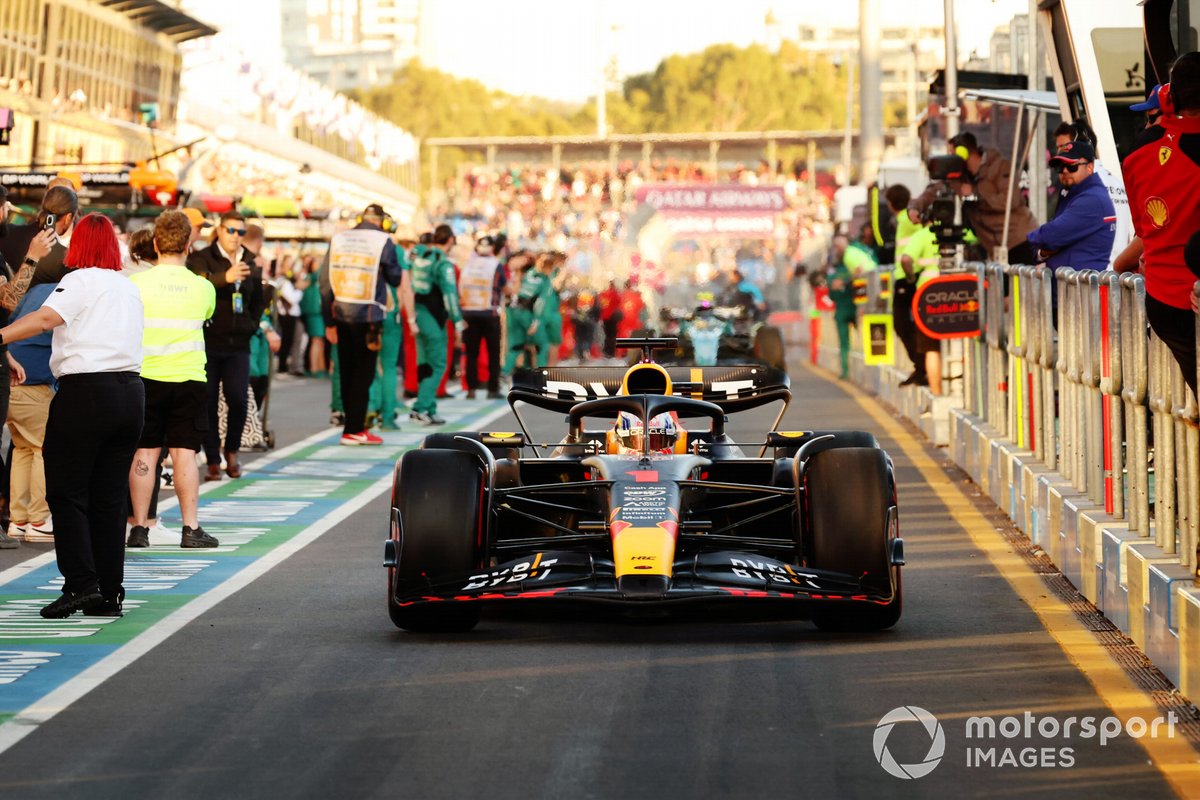 Max Verstappen, Red Bull Racing RB19, celebrates as he returns to the pits