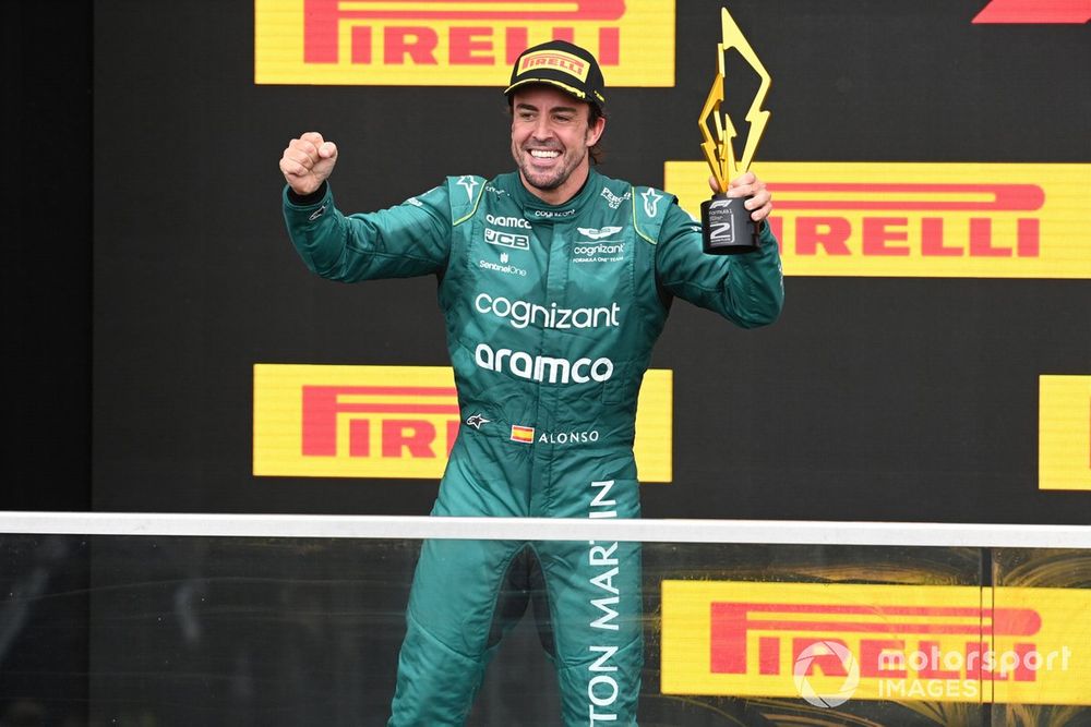 Fernando Alonso, Aston Martin F1 Team, 2nd position, celebrates on the podium with his trophy