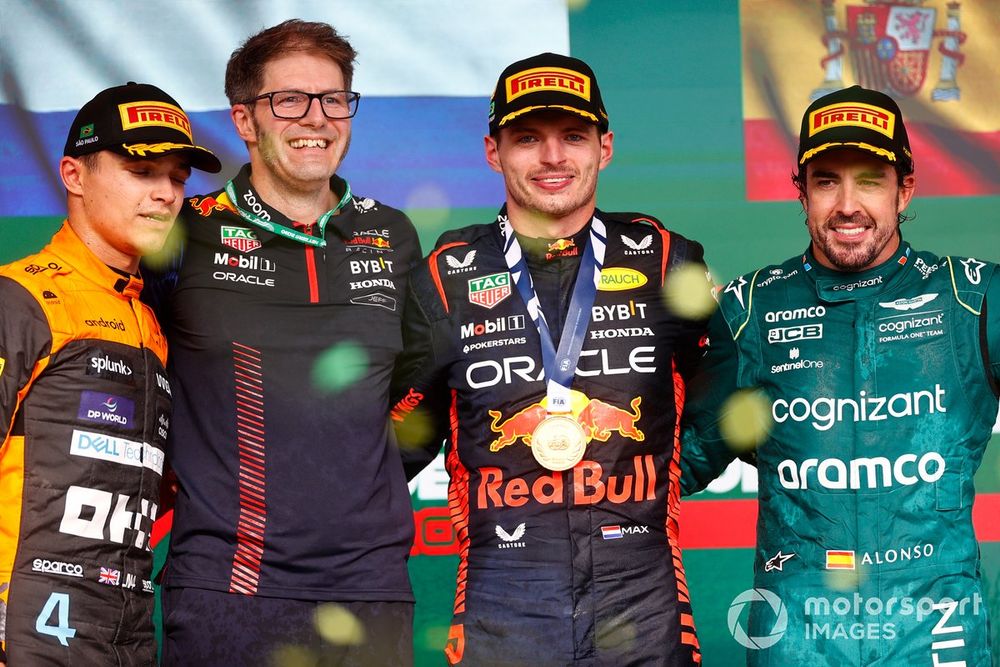 Lando Norris, McLaren, 2nd position, the Red Bull trophy delegate, Max Verstappen, Red Bull Racing, 1st position, and Fernando Alonso, Aston Martin F1 Team, 3rd position, on the podium