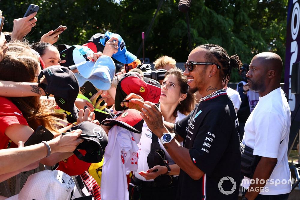 Lewis Hamilton, Mercedes-AMG signs an autograph for a fan