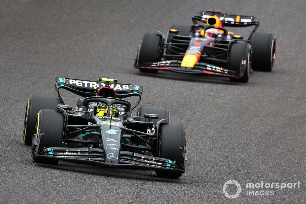 Sir Lewis Hamilton, Mercedes F1 W14, leads Max Verstappen, Red Bull Racing RB19