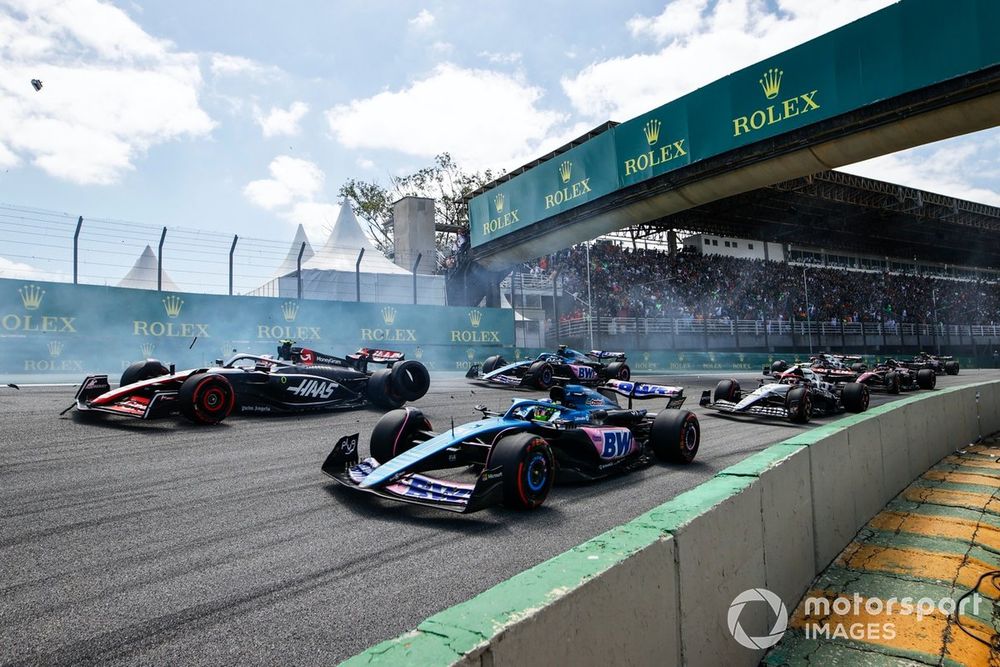 A tyre from the crash between Alex Albon, Williams FW45, Kevin Magnussen, Haas VF-23, bounces between Esteban Ocon, Alpine A523, Nico Hulkenberg, Haas VF-23
