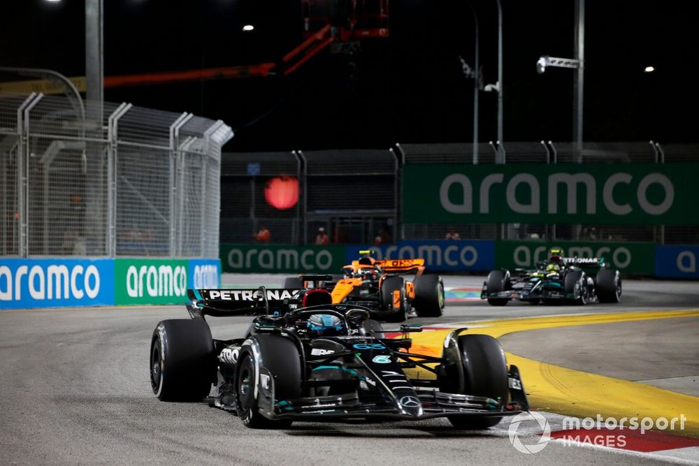 George Russell, Mercedes F1 W14, leads Lando Norris, McLaren MCL60, and Sir Lewis Hamilton, Mercedes F1 W14