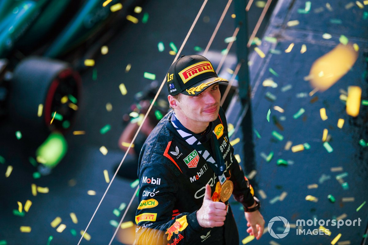 Max Verstappen, Red Bull Racing, 1st position, with his medal on the podium