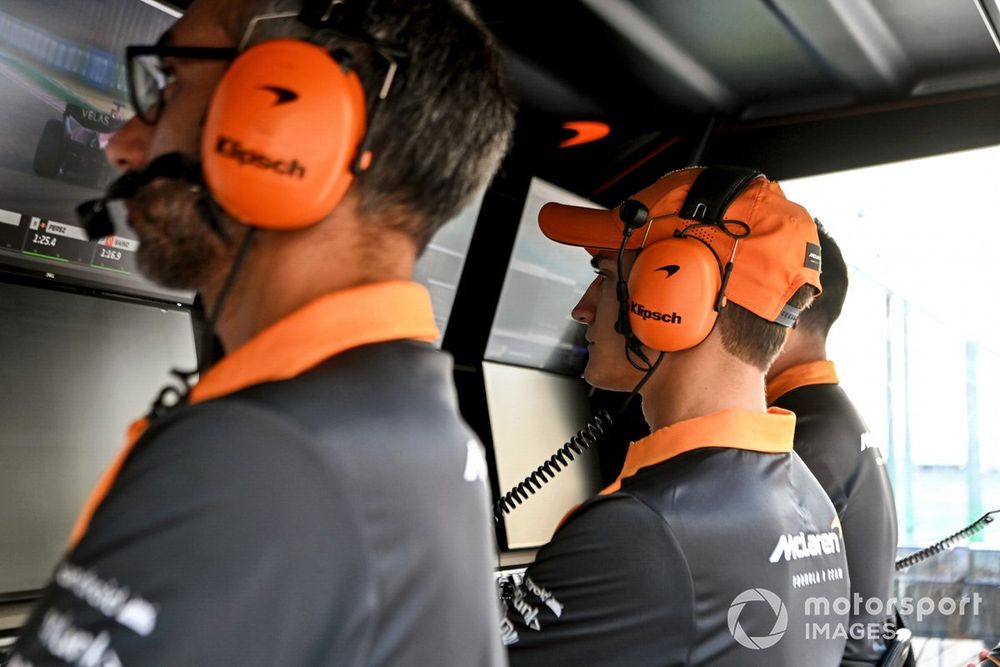 Alex Palou, McLaren, on the pit wall