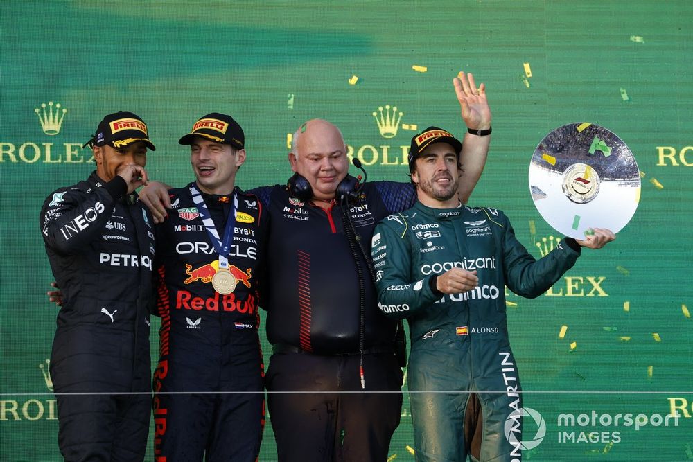 Sir Lewis Hamilton, Mercedes-AMG, 2nd position, Max Verstappen, Red Bull Racing, 1st position, Rob Marshall and Fernando Alonso, Aston Martin F1 Team, 3rd position, on the podium