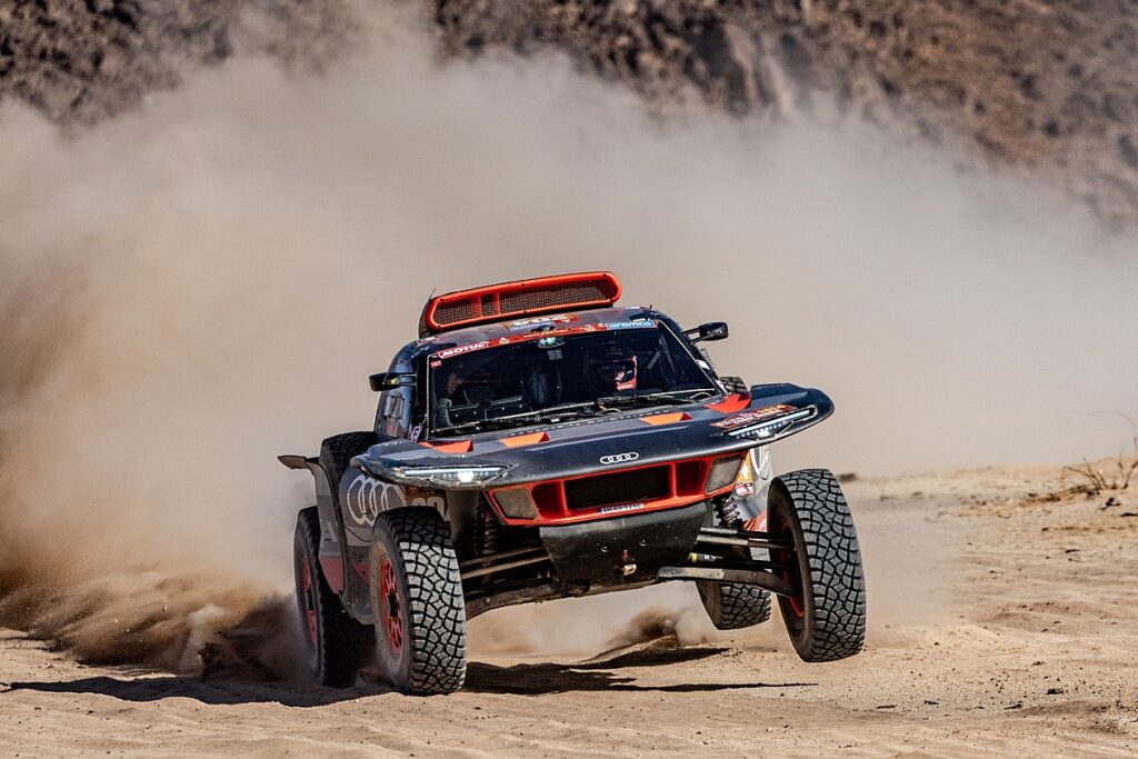 Sainz clinches historic win for Audi, Loeb third
