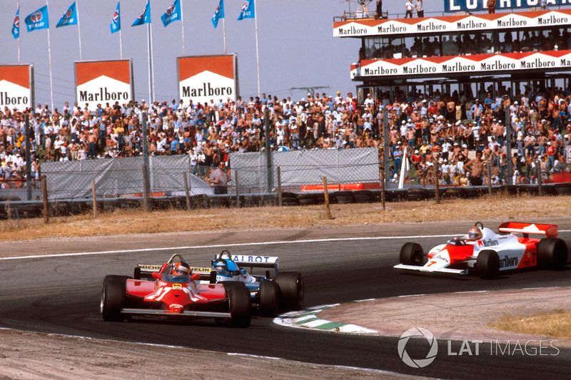 Gilles Villeneuve, Ferrari 126CK followed by Jacques Laffite, Ligier JS17 Matra and John Watson, McLaren MP4/1 Ford.