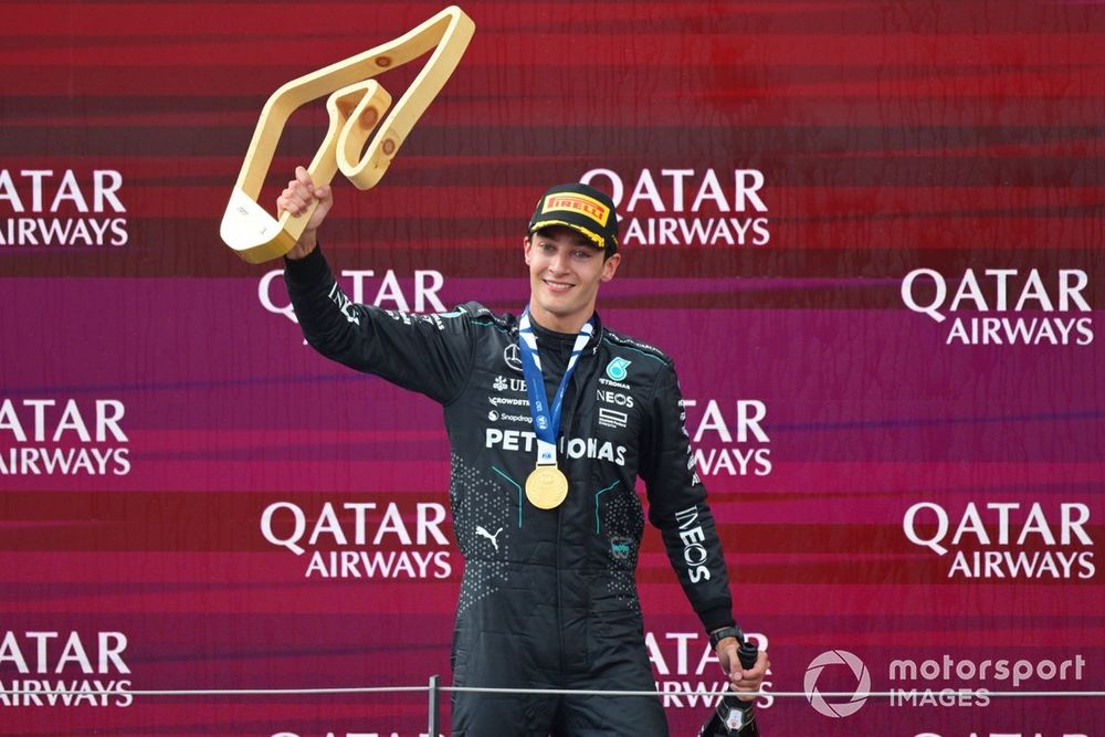 George Russell, Mercedes-AMG F1 Team, 1st position, on the podium with his trophy and Champagne