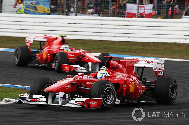 Felipe Massa, Ferrari F10 leads Fernando Alonso, Ferrari F10