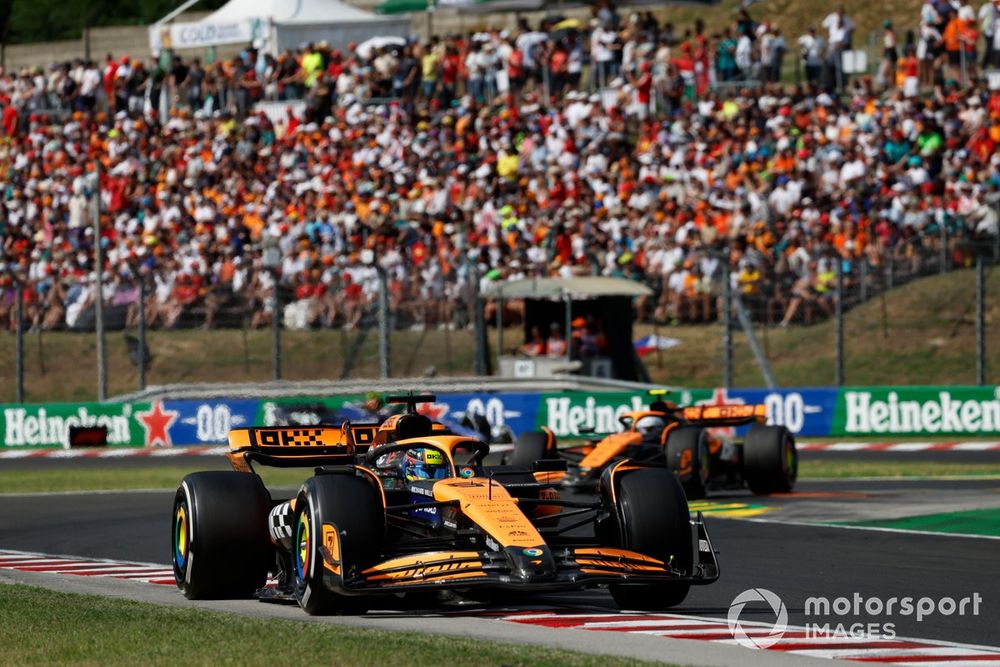 Oscar Piastri, McLaren MCL38, leads Lando Norris, McLaren MCL38