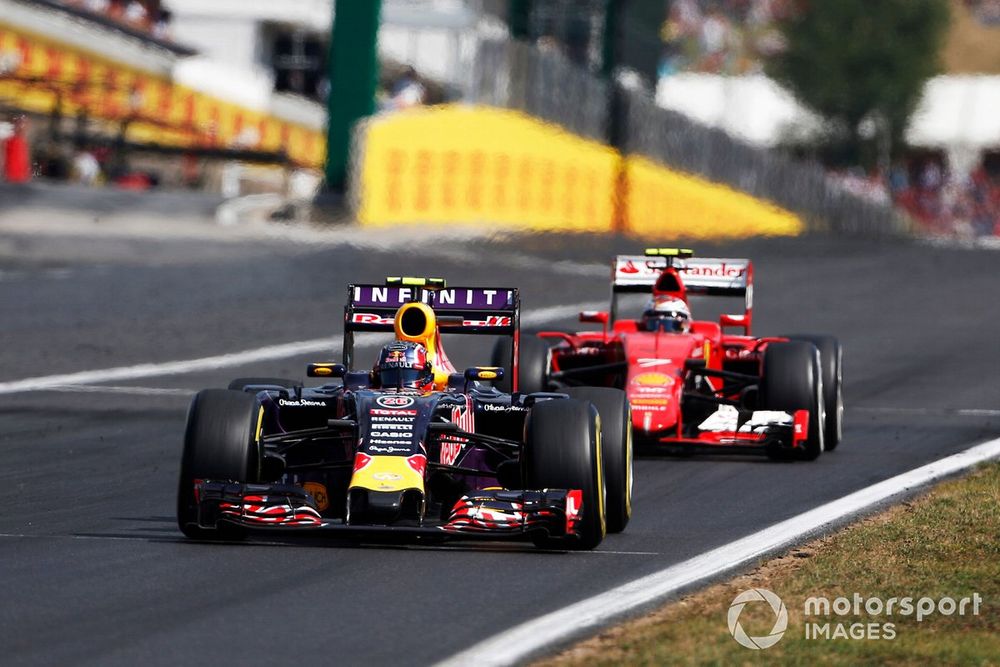 Daniil Kvyat, Red Bull Racing RB11 Renault, leads Kimi Raikkonen, Ferrari SF-15T
