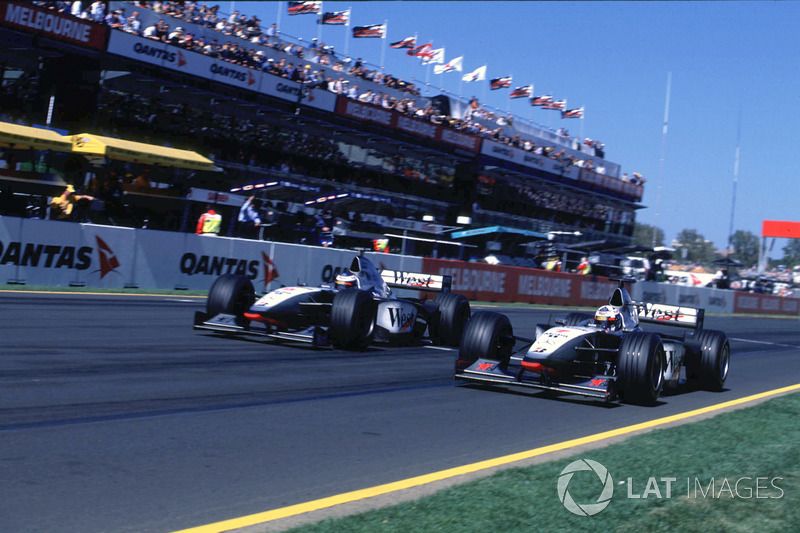 Mika Hakkinen, McLaren Mercedes passes David Coulthard, McLaren