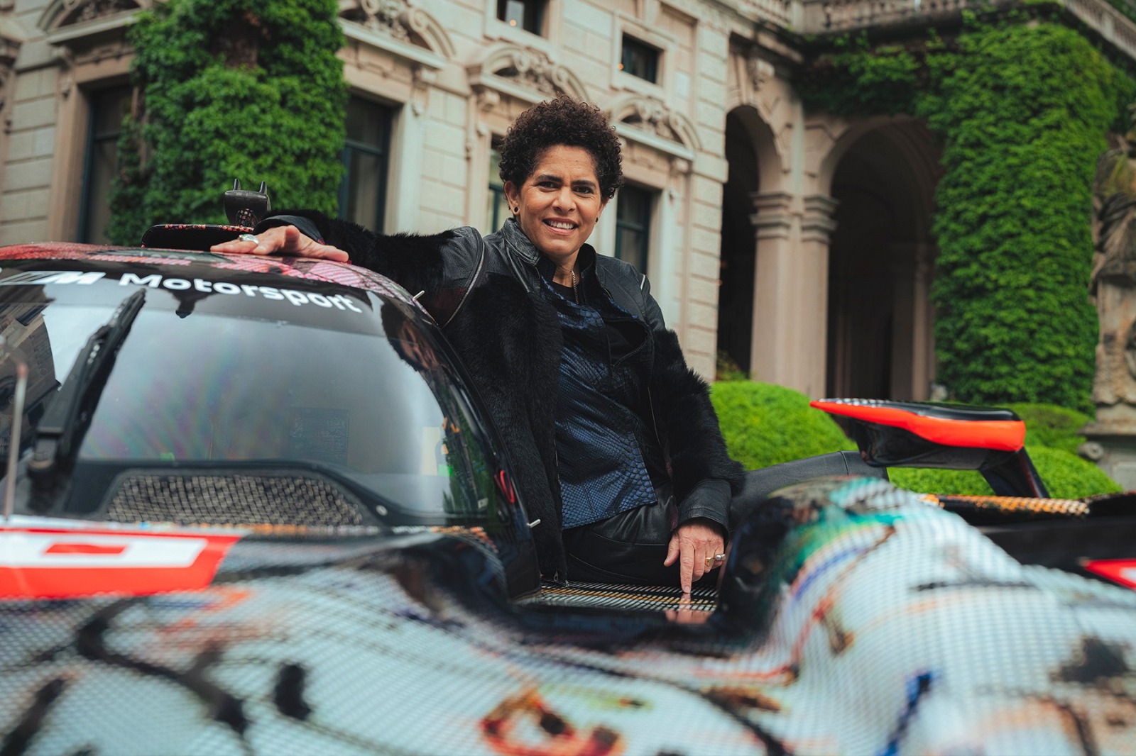 Artist Julie Mehretu with her BMW M Hybrid V8 Art Car