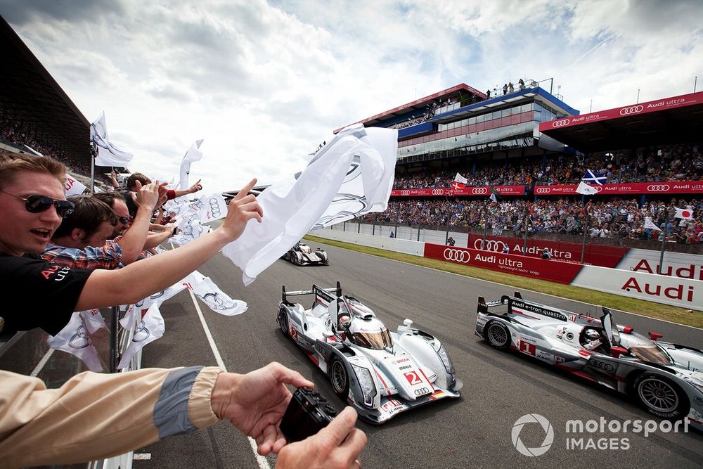 Race winners #1 Audi Sport Team Joest Audi R18 E-Tron Quattro: Marcel Fässler, Andre Lotterer, Benoit Tréluyer and #2 Audi Sport Team Joest Audi R18 E-Tron Quattro: Rinaldo Capello, Tom Kristensen, Allan McNish crosses the line 