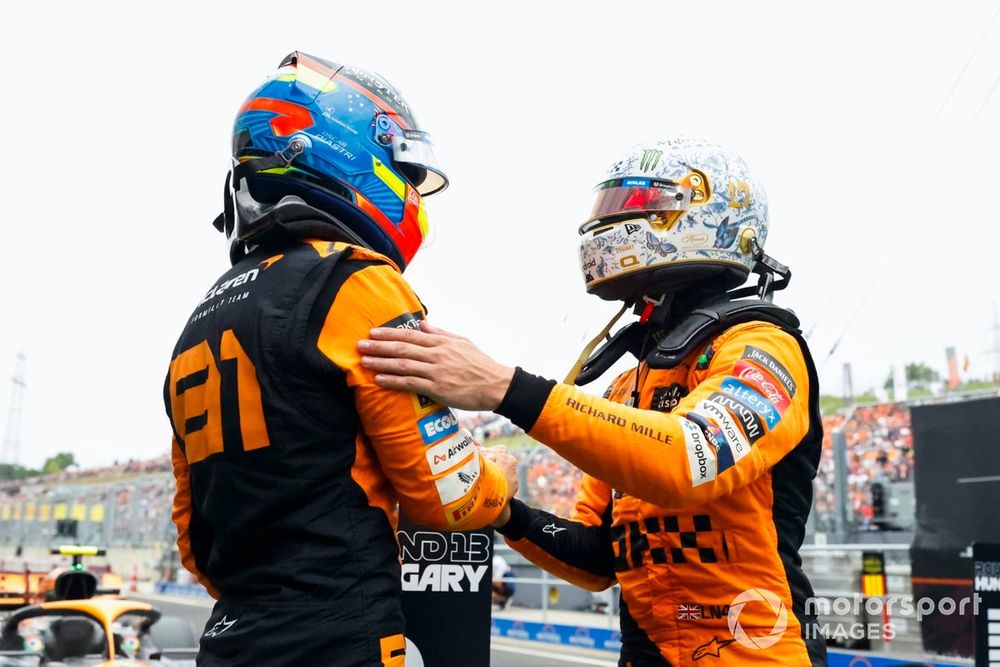 Oscar Piastri, McLaren F1 Team, Lando Norris, McLaren F1 Team, celebrate in Parc Ferme after locking out the front row