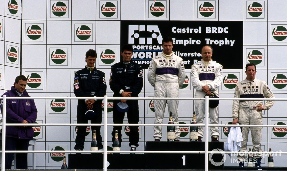 Brundle looks spent as he stands alone on the rostrum in third after a Herculean effort aboard the XJR-14