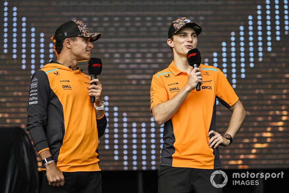 Lando Norris, McLaren F1 Team, Oscar Piastri, McLaren F1 Team, are interviewed by Ariana Bravo, F1 Digital presenter, on stage in the Fan Zone